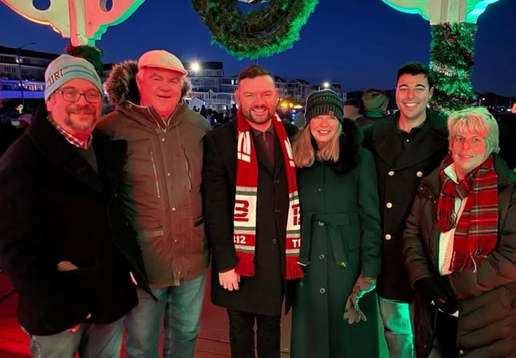 Council members at a holiday lighting event